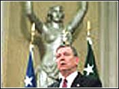 Attorney General John Ashcroft in front Spirit of Justice statue