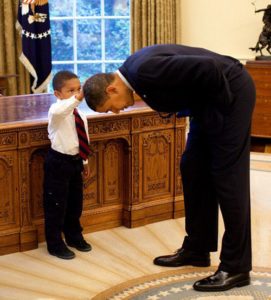 President Obama looks to be bowing to 5-year-old Jacob Philadelphia, his arm raised to touch the president’s hair — to see if it feels like his.