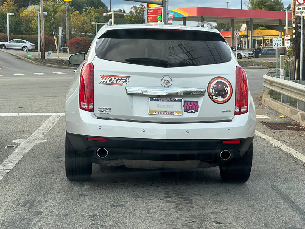 Car with 'Women for Trump 2020' sticker.